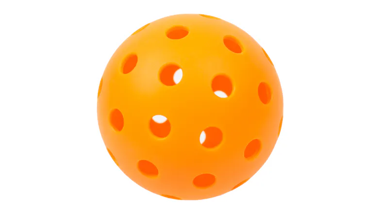Outdoor pickleball ball with high-visibility orange finish and aerodynamic hole pattern Outdoor pickleball ball with high-visibility orange finish and aerodynamic hole pattern