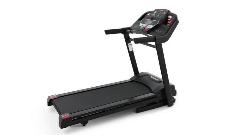 Angled view of the F60 treadmill featuring workout controls and a spacious running surface Angled view of the F60 treadmill featuring workout controls and a spacious running surface