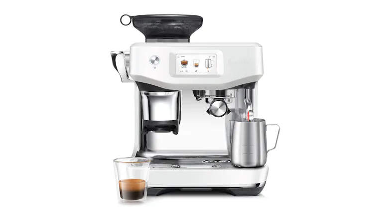 A front-view of Barista Touch Impress Automatic Espresso Machine with clear glass and a pitcher. A front-view of Barista Touch Impress Automatic Espresso Machine with clear glass and a pitcher.