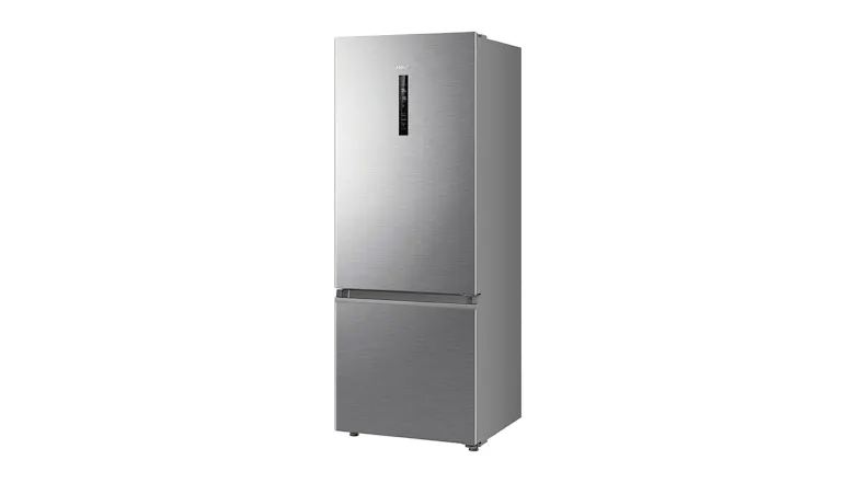 Angled view of the Haier 309L fridge freezer, highlighting the recessed handles and sleek design Angled view of the Haier 309L fridge freezer, highlighting the recessed handles and sleek design