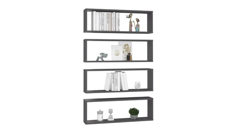 Four vertically stacked grey floating box shelves holding books, small figurines, a plant, and décor Four vertically stacked grey floating box shelves holding books, small figurines, a plant, and décor