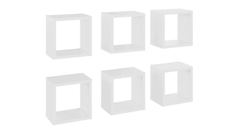 Angled view of six floating cube wall shelves in white, shown in two rows Angled view of six floating cube wall shelves in white, shown in two rows