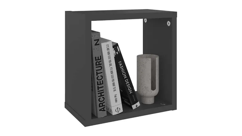 A single black NNEVL cube shelf holding three books and a small grey cylindrical vase A single black NNEVL cube shelf holding three books and a small grey cylindrical vase