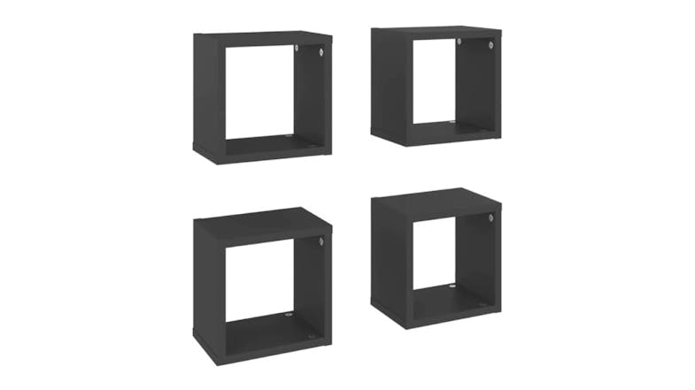Angled view of four floating cube wall shelves in grey, shown in two rows Angled view of four floating cube wall shelves in grey, shown in two rows