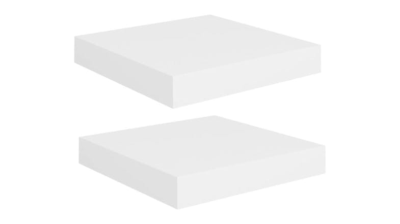 Two white floating wall shelves displayed on a white background, shown from an angled view Two white floating wall shelves displayed on a white background, shown from an angled view