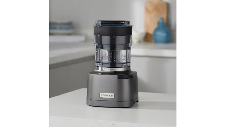 Sleek grey Kenwood Chopper & Grinder in a modern kitchen setting Sleek grey Kenwood Chopper & Grinder in a modern kitchen setting