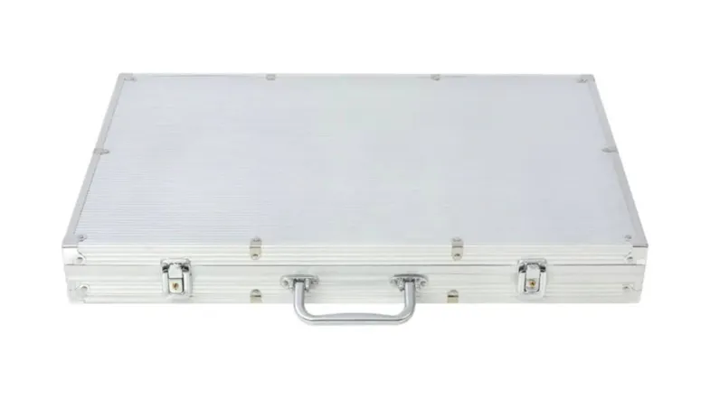 A closed silver aluminium briefcase with two latches and a metal handle A closed silver aluminium briefcase with two latches and a metal handle