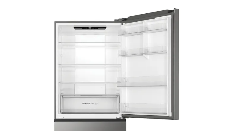 Close-up of the upper fridge section showing the digital temperature control panel and glass shelving Close-up of the upper fridge section showing the digital temperature control panel and glass shelving