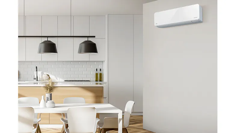 Wall-mounted Fujitsu air conditioner in a modern kitchen and dining area Wall-mounted Fujitsu air conditioner in a modern kitchen and dining area