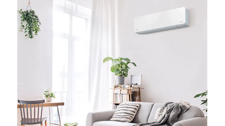 Bright living room with a minimalist Fujitsu heat pump air conditioner Bright living room with a minimalist Fujitsu heat pump air conditioner