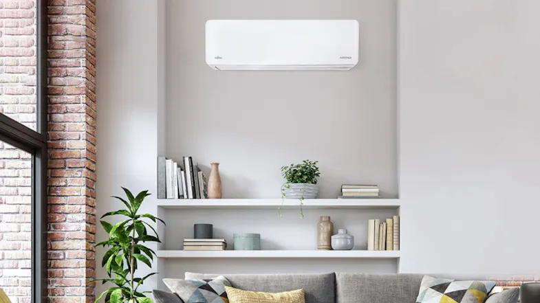 Bright living room with a minimalist Fujitsu heat pump air conditioner Bright living room with a minimalist Fujitsu heat pump air conditioner