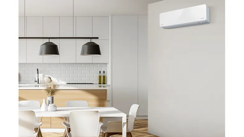 Wall-mounted Fujitsu air conditioner in a cosy room Wall-mounted Fujitsu air conditioner in a cosy room