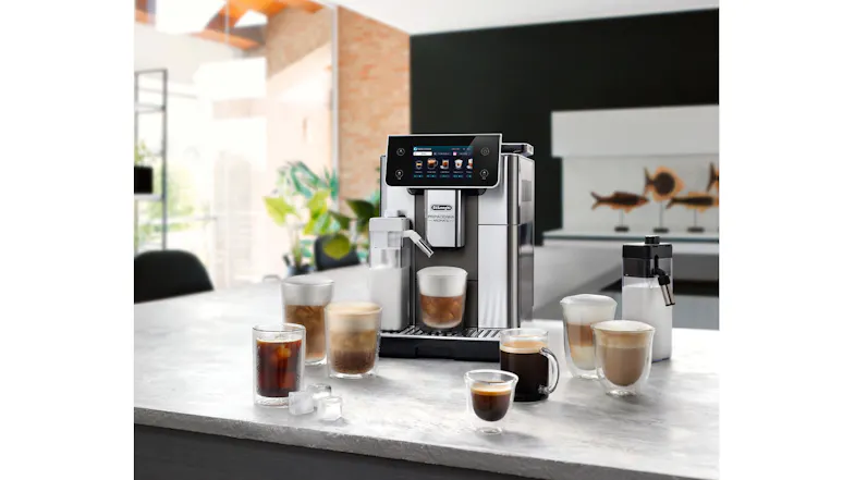 De’Longhi coffee machine on a kitchen counter with multiple cups of espresso, cappuccino, latte, and iced coffee drinks De’Longhi coffee machine on a kitchen counter with multiple cups of espresso, cappuccino, latte, and iced coffee drinks