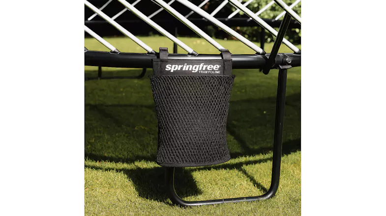 Mesh storage basket attached under a trampoline frame for convenient outdoor accessory organisation Mesh storage basket attached under a trampoline frame for convenient outdoor accessory organisation