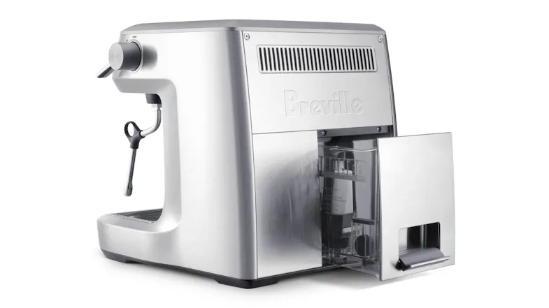 Rear view of an espresso machine with an open water tank Rear view of an espresso machine with an open water tank