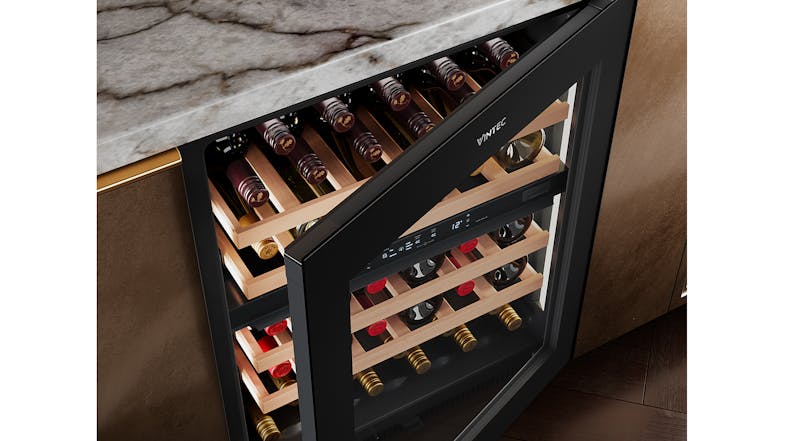 A Vintec 40-bottle wine fridge integrated into a luxury home bar setup A Vintec 40-bottle wine fridge integrated into a luxury home bar setup