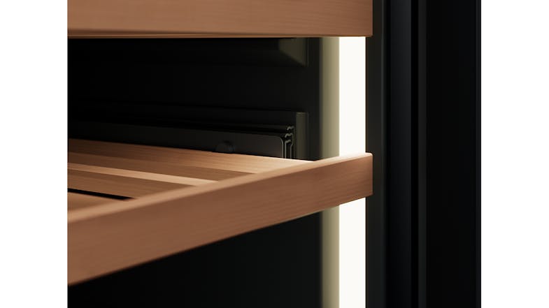 Interior view highlighting the premium natural wood shelf and the black cabinet lining of a Vintec wine fridge Interior view highlighting the premium natural wood shelf and the black cabinet lining of a Vintec wine fridge