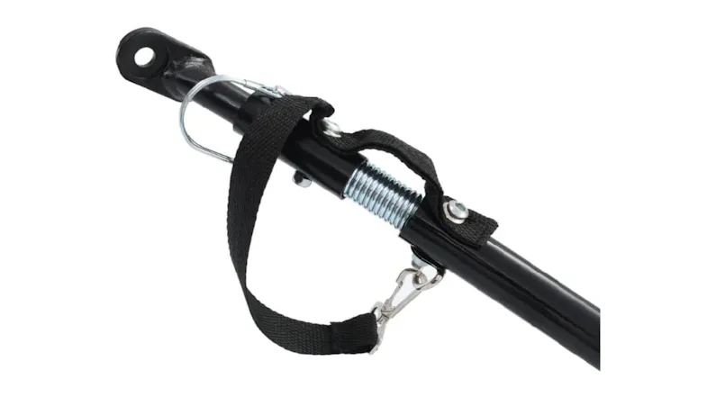 Close-up of the NNEVL steel-frame bike cargo trailer hitch, showing a black metal arm, silver spring, safety strap, and attachment pin Close-up of the NNEVL steel-frame bike cargo trailer hitch, showing a black metal arm, silver spring, safety strap, and attachment pin
