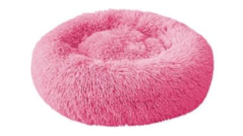 A round, fluffy, rose pet bed designed for small animals like cats or dogs. A round, fluffy, rose pet bed designed for small animals like cats or dogs.