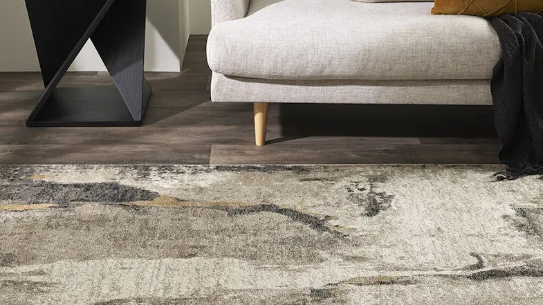 A close up view of the aurora rug in a modern living room A close up view of the aurora rug in a modern living room