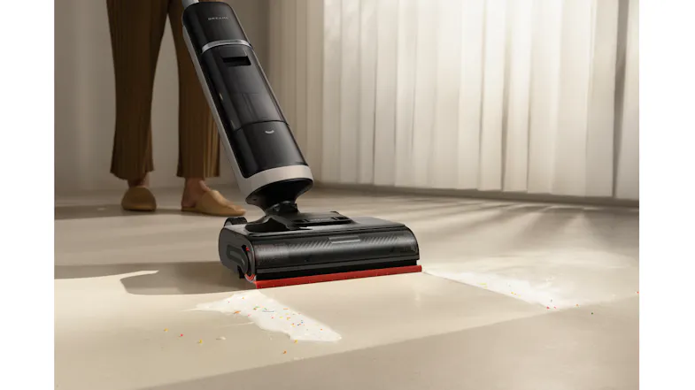 The unit being used to clean out spilled milk on the floor The unit being used to clean out spilled milk on the floor