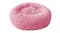A round, fluffy, pink pet bed designed for small animals like cats or dogs. A round, fluffy, pink pet bed designed for small animals like cats or dogs.