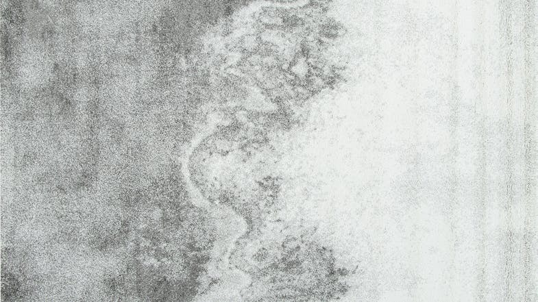 A rectangular rug featuring a blue-toned pattern with subtle distressed textures. A rectangular rug featuring a blue-toned pattern with subtle distressed textures.