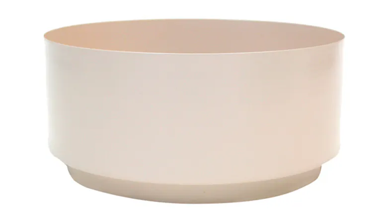 A minimalist planter with a beige finish and a wide opening A minimalist planter with a beige finish and a wide opening