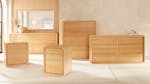 A collection of light wood bedroom furniture, including bedside tables and dressers. A collection of light wood bedroom furniture, including bedside tables and dressers.