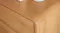 A close-up of a small lowboy, showing its smooth, rounded corner. A close-up of a small lowboy, showing its smooth, rounded corner.