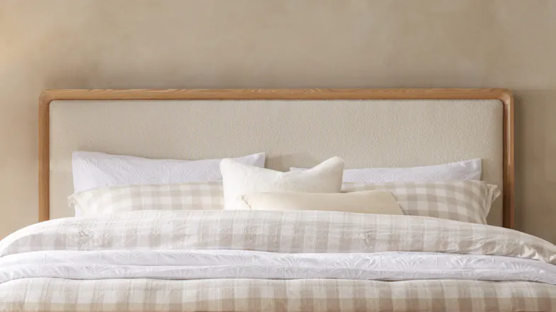 A complete bedroom set featuring the Omaha Upholstered Headboard, complemented by matching bedside tables and a large area rug. A complete bedroom set featuring the Omaha Upholstered Headboard, complemented by matching bedside tables and a large area rug.