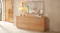 A sleek mirror mounted above a wooden dresser, reflecting the bedroom decor. A sleek mirror mounted above a wooden dresser, reflecting the bedroom decor.