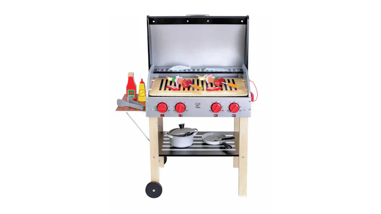 A toy grill set with an open silver lid reveals a grill surface with toy skewers and vegetables. A toy grill set with an open silver lid reveals a grill surface with toy skewers and vegetables.