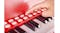 A child playing the red toy piano. A child playing the red toy piano.