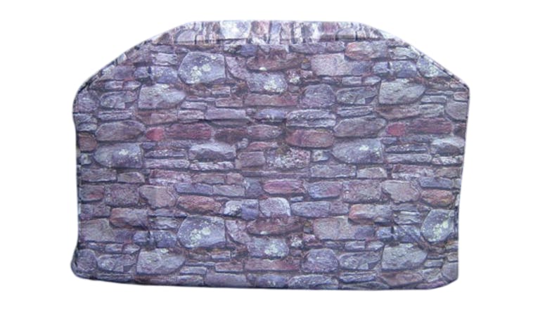 A rectangular cover with rounded top corners, featuring a printed pattern that resembles a stone wall. A rectangular cover with rounded top corners, featuring a printed pattern that resembles a stone wall.