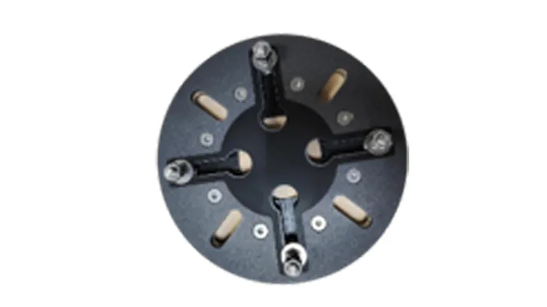 A top-down view of a round umbrella base plate with four weight-holding sections. A top-down view of a round umbrella base plate with four weight-holding sections.