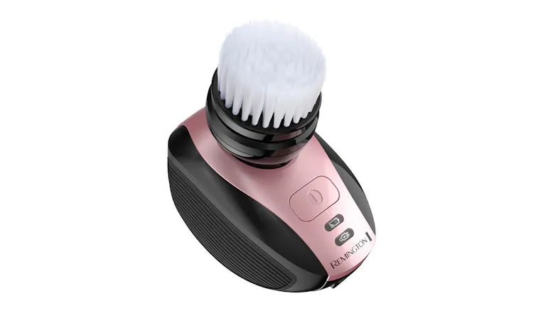 An angled view of the shaver with an exfoliating brush attached, facing right. An angled view of the shaver with an exfoliating brush attached, facing right.