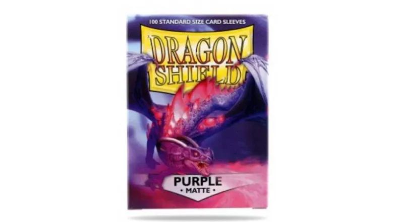 A box containing 100 Dragon Shield protective card sleeves, in matte purple colour. A box containing 100 Dragon Shield protective card sleeves, in matte purple colour.
