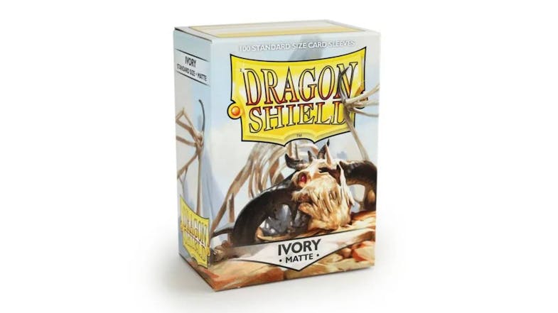 A box containing 100 Dragon Shield protective card sleeves in matte ivory colour. A box containing 100 Dragon Shield protective card sleeves in matte ivory colour.