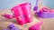 A pink sand bucket with a child's name on it, demonstrating the vinyl’s non-toxic design. A pink sand bucket with a child's name on it, demonstrating the vinyl’s non-toxic design.
