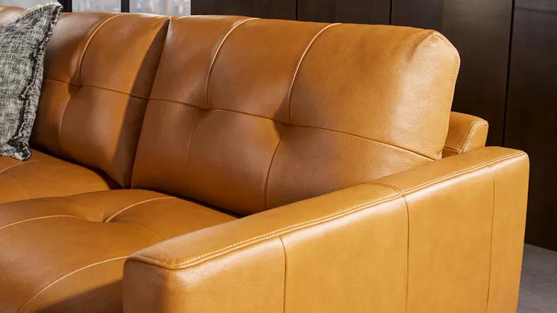 A side view of a leather loveseat showing sleek armrests A side view of a leather loveseat showing sleek armrests