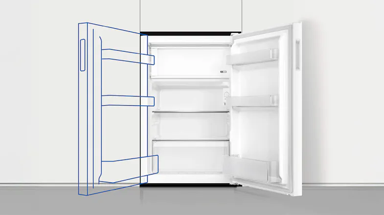 An open fridge built into white cabinetry An open fridge built into white cabinetry