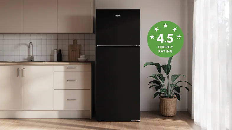 A refrigerator in a kitchen, displaying a green 4.5-star energy rating badge A refrigerator in a kitchen, displaying a green 4.5-star energy rating badge
