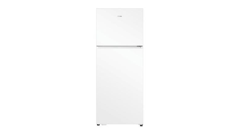 A closed white Haier fridge with top freezer and bottom fridge compartments A closed white Haier fridge with top freezer and bottom fridge compartments