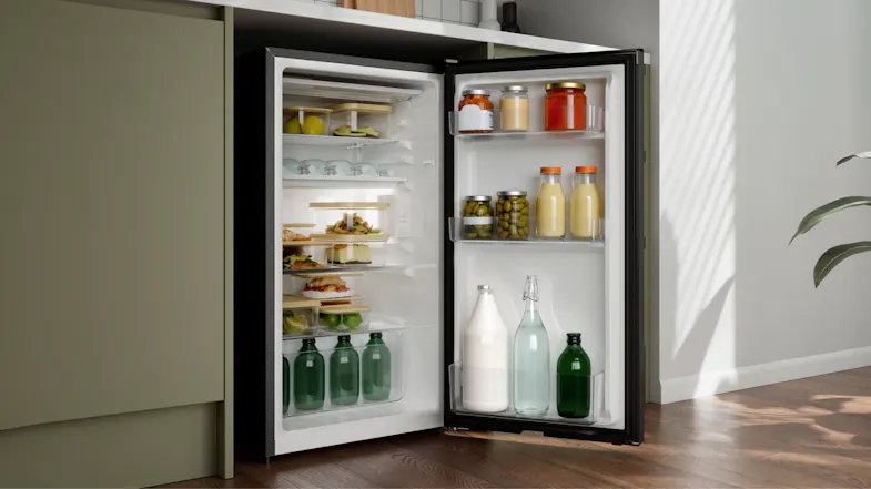 Stocked Haier fridge with drinks, condiments, and containers with food Stocked Haier fridge with drinks, condiments, and containers with food