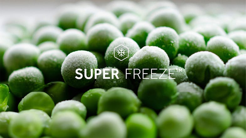 A macro shot of frozen peas highlighting the "Super Freeze" function A macro shot of frozen peas highlighting the "Super Freeze" function