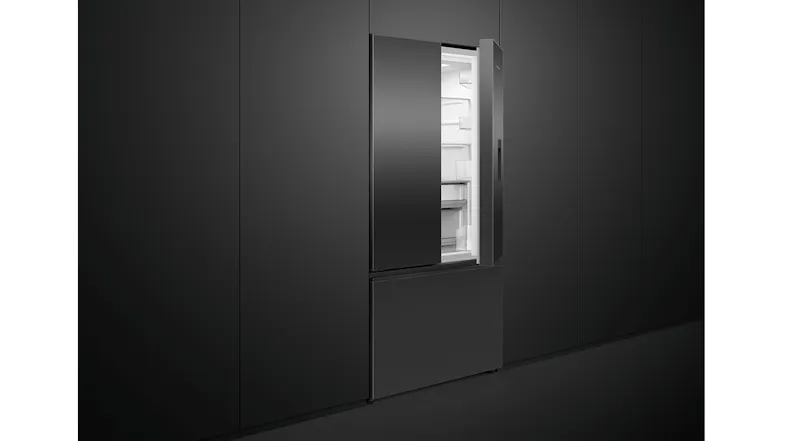 A refrigerator with one door open, fitted to a black kitchen cabinetry A refrigerator with one door open, fitted to a black kitchen cabinetry