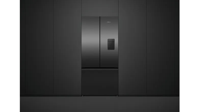 Black fridge with a water dispenser fitted to black cabinetry Black fridge with a water dispenser fitted to black cabinetry