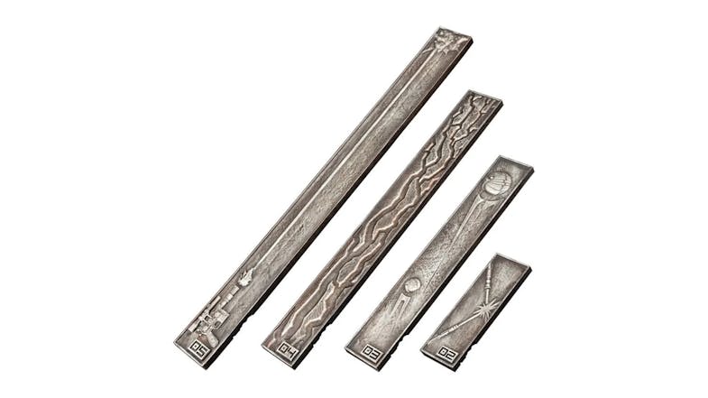 A collection of four engraved metal bars in varying sizes A collection of four engraved metal bars in varying sizes