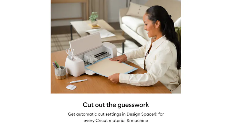 A person using a Cricut machine at a home workspace A person using a Cricut machine at a home workspace